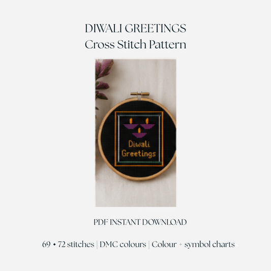 Magenta Diwali Greetings diya cross stitch pattern shown finished in an embroidery hoop