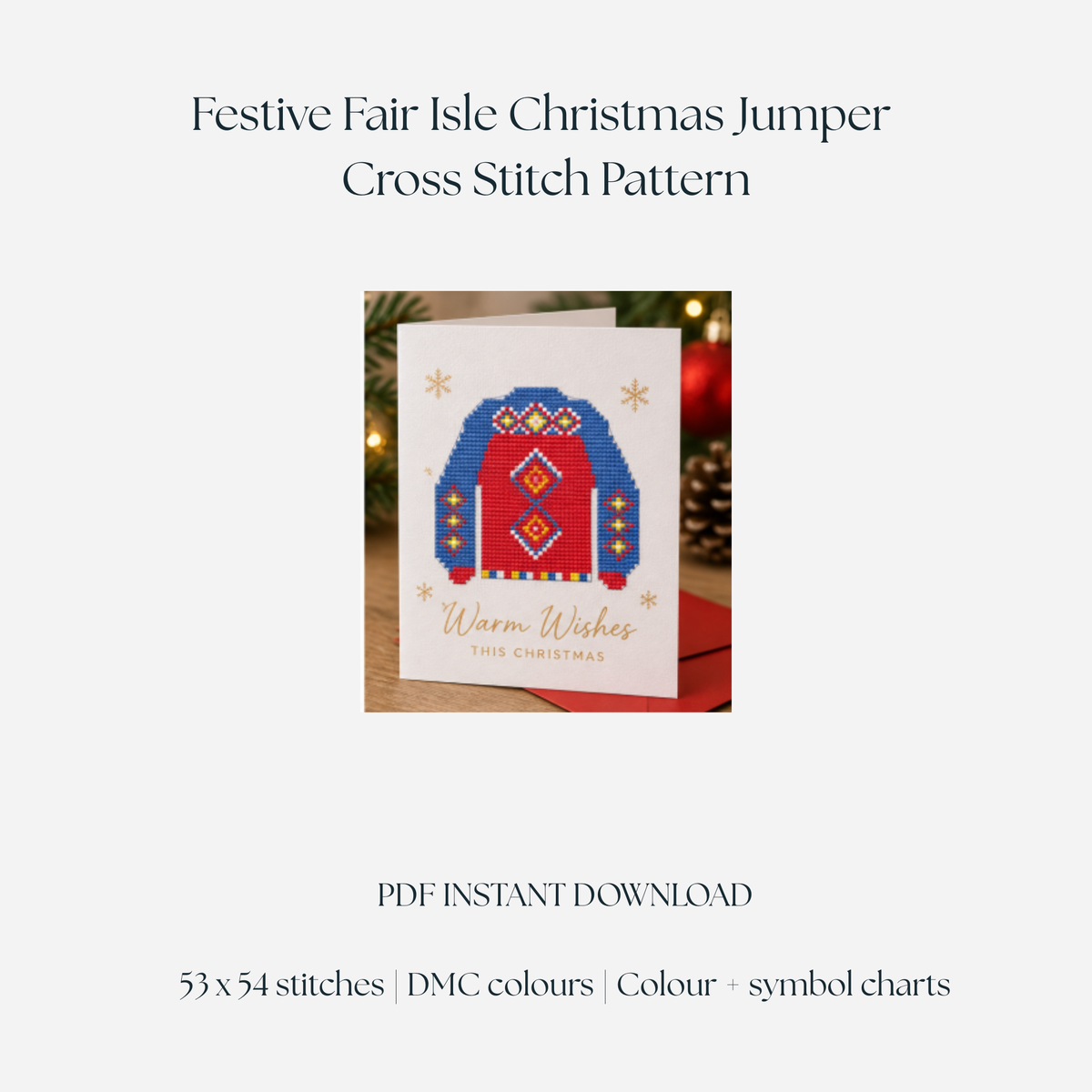 Digital mock-up of a red and blue Fair Isle Christmas jumper cross stitch design on a festive greeting card with gold snowflakes and Warm Wishes lettering.